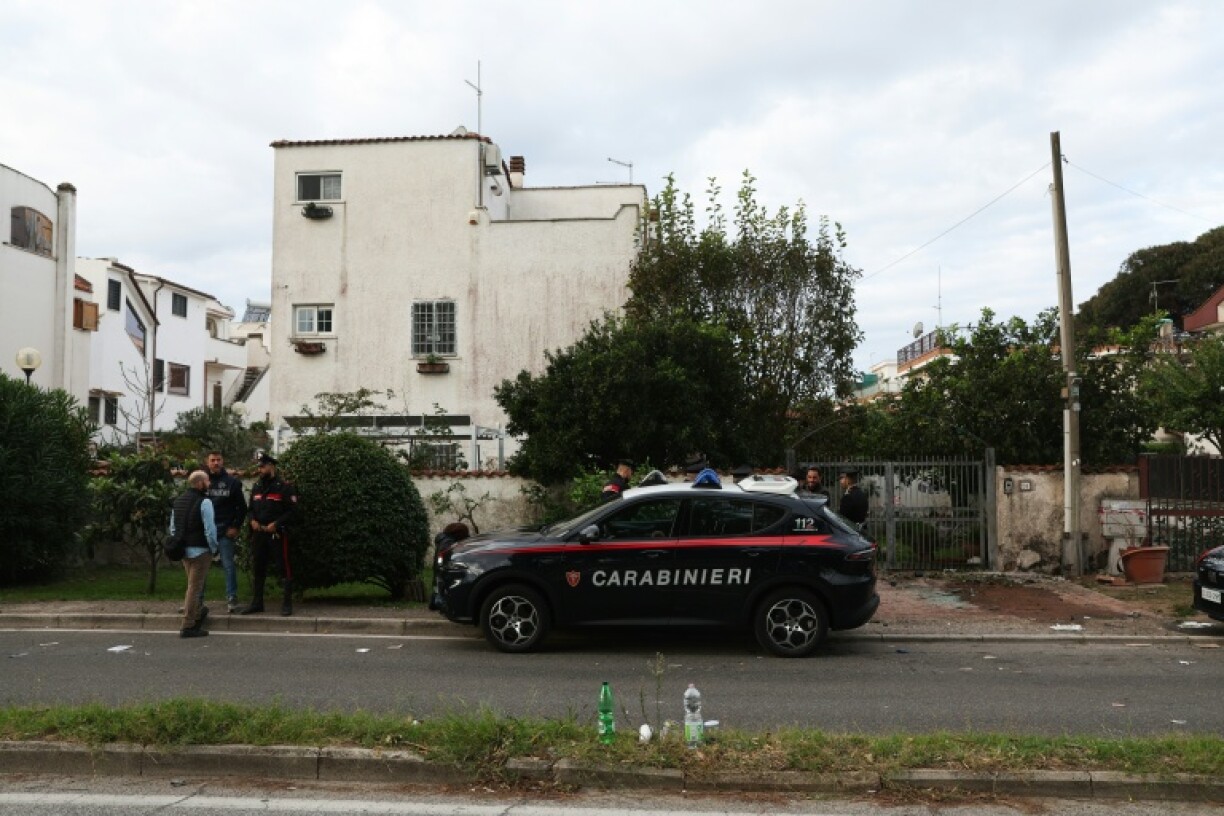 Italian paramilitary forces stand guard in front of Ranucci's house after the car bombing