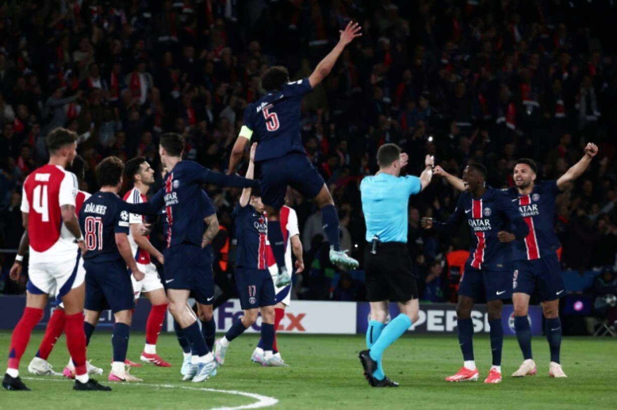Paris Saint-Germain players celebrate as the referee blows the final whistle in the Champions League semi-final second leg victory against Arsenal