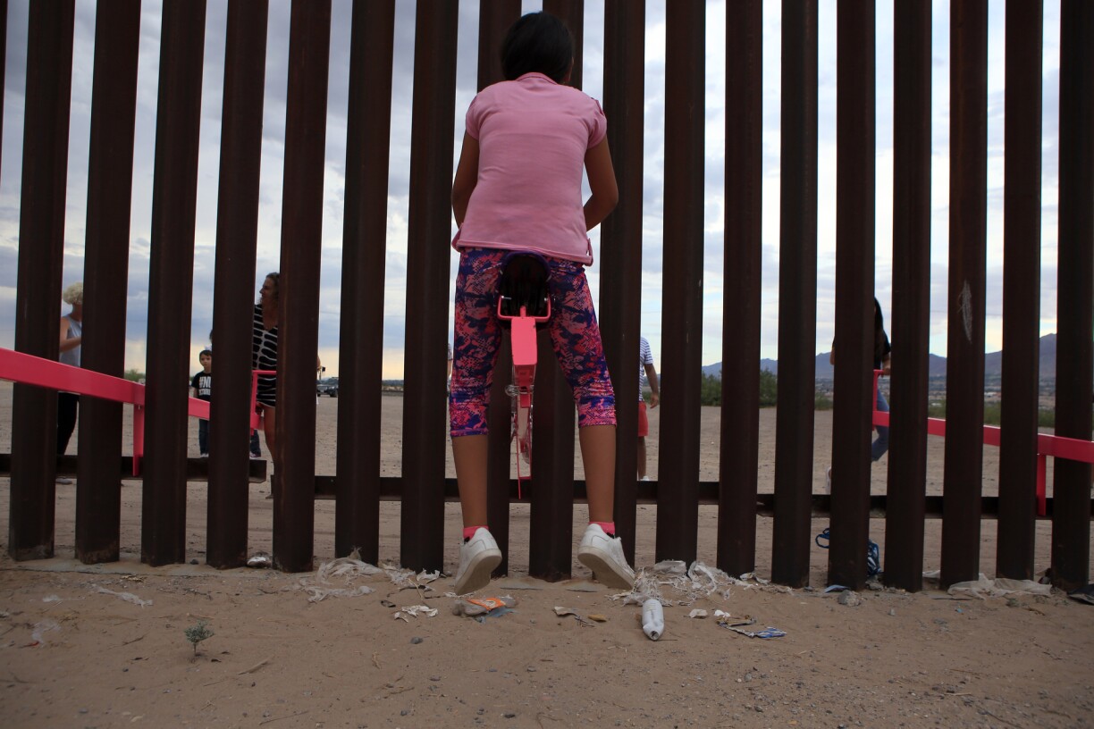 American and Mexican families play with a toy called