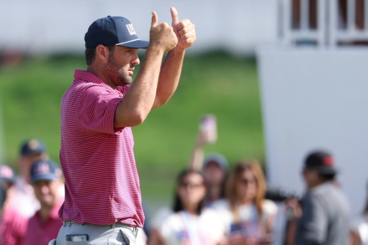 World number one Scottie Scheffler of the United States tells Colombian Nico Echavarria of the Internationals to pick up his ball during a 2&1 Scheffler victory in singles at the Presidents Cup
