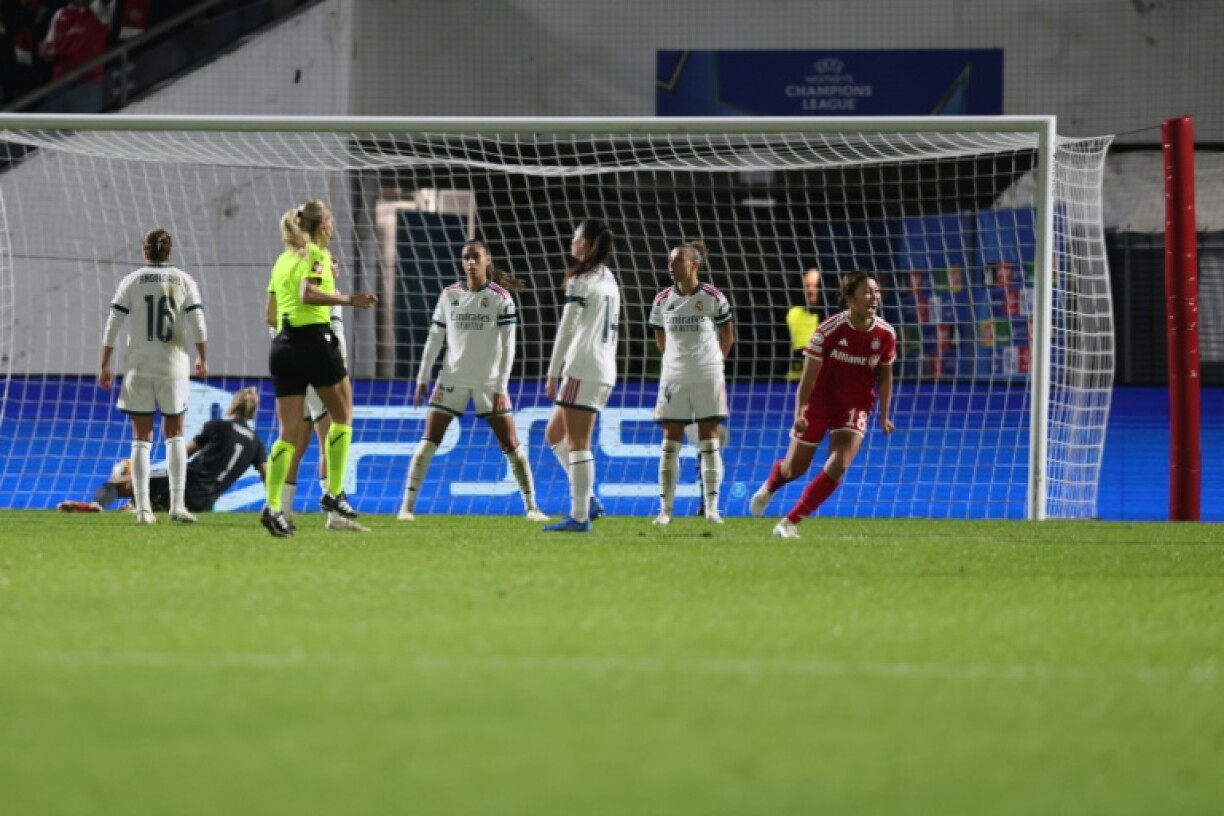 Bayern Munich's Momoko Tanikawa (R) turns away in celebration after making it 2-2 against Real Madrid