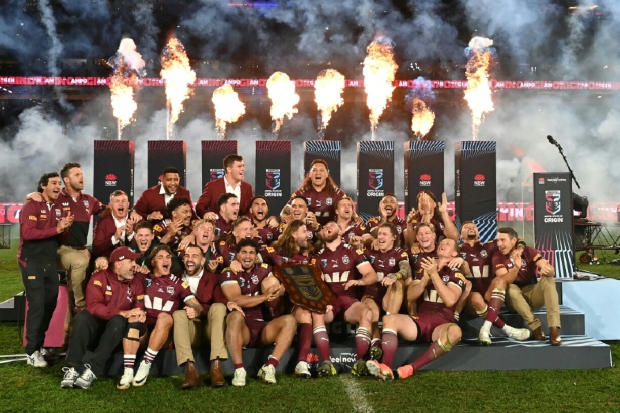 Queensland Maroons players celebrate after winning the State of Origin rugby league series