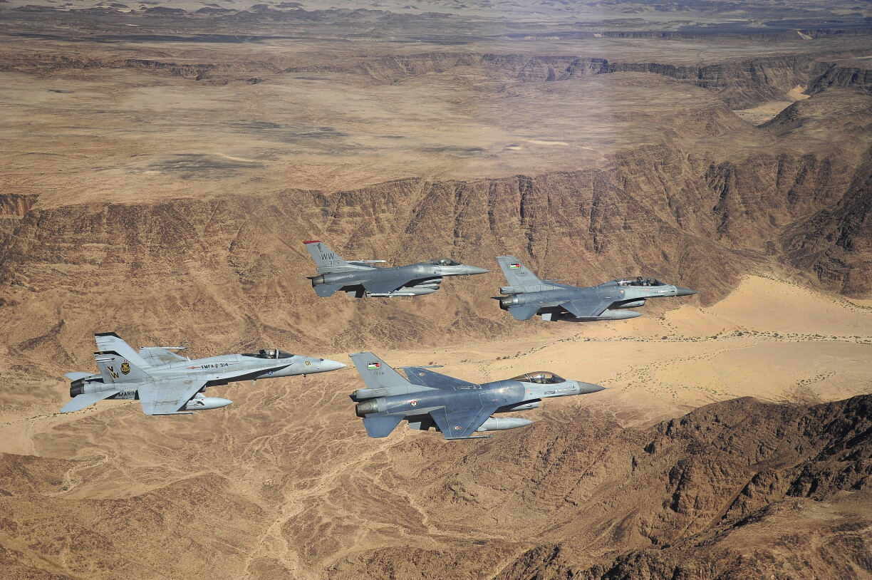 F-16 Fighting Falcons from the US and Royal Jordanian Air Forces, along with an F-18 Hornet from the US Marine Corps, fly over the Wadi Rum desert in Jordan during Exercise Eager Tiger.