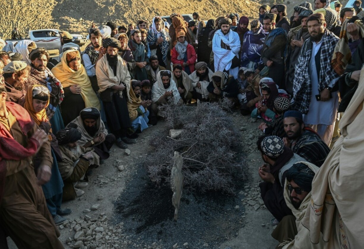 Afghan men offered prayers around the grave of Khalil Ur-Rahman Haqqani, the Minister for Refugees and Repatriation, during his funeral ceremony in Sarana village in Paktia province, south of the capital Kabul
