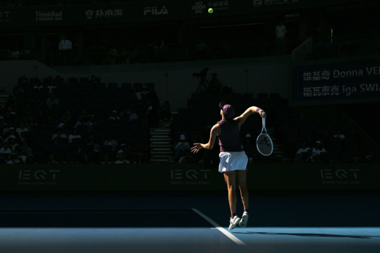 Poland’s Iga Swiatek serves to Croatia’s Donna Vekic during the China Open tennis tournament in Beijing