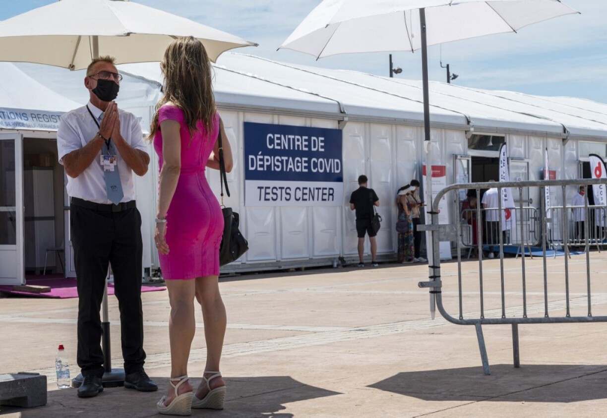 A woman arrives to get tested at a Covid centre in Cannes, southern France, on July 7, 2021, amidst a growing discontent regarding saliva-testings amongst festival attendees.