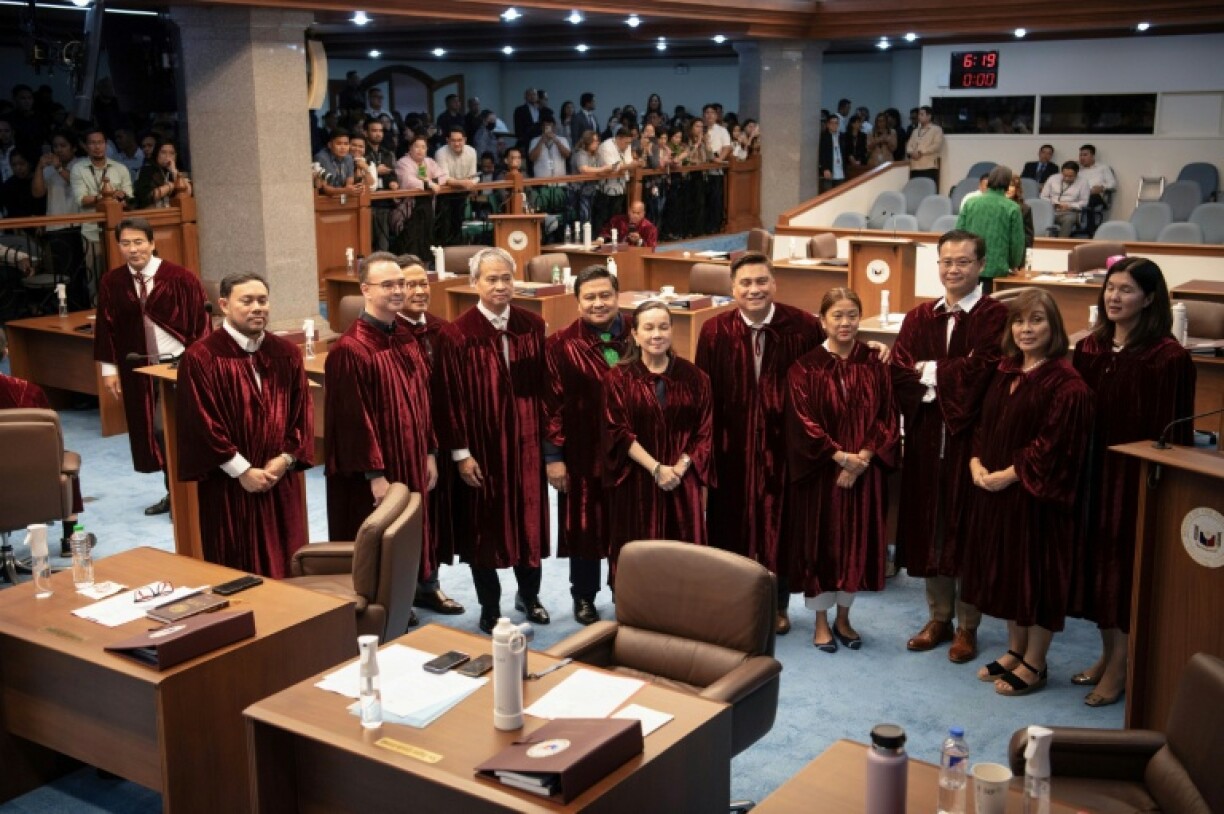 Philippine senators pose before taking their oaths as jurors in the impeachment trial of Vice President Sara Duterte