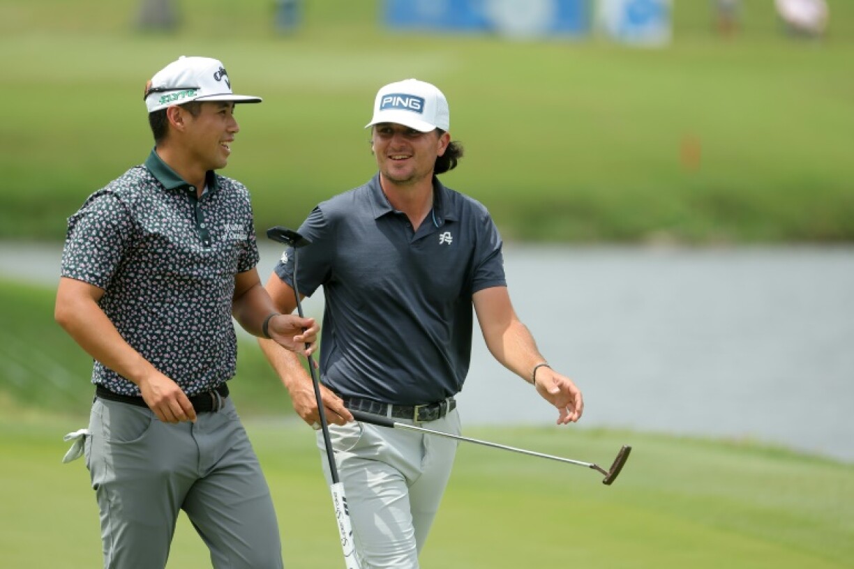 Americans Isaiah Salinda, left, and Kevin Velo, right, combined to fire a four-ball record 14-under 58 and seize the first-round lead at the PGA Tour's Zurich Classic pairs event