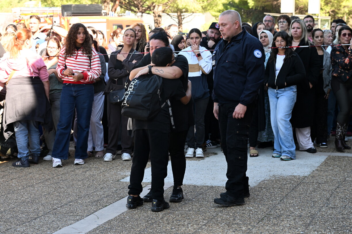 Pupils are comforted by their parents as they leave Joseph-Lakanal high school after a headmaster was injured by a hunting rifle shot and a teenager was arrested in Aubagne, southern France, on 12 October 2026.