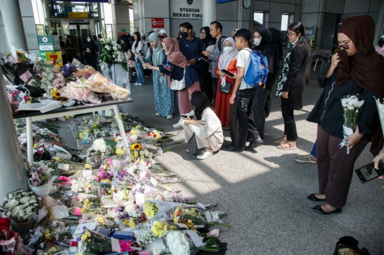 Sixteen women died when a long-distance train smashed into a stalled commuter train outside Jakarta