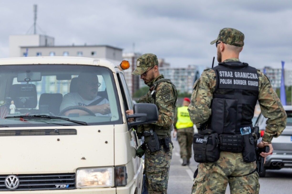 Polish border guards check drivers at the Polish-German border in Slubice, western Poland