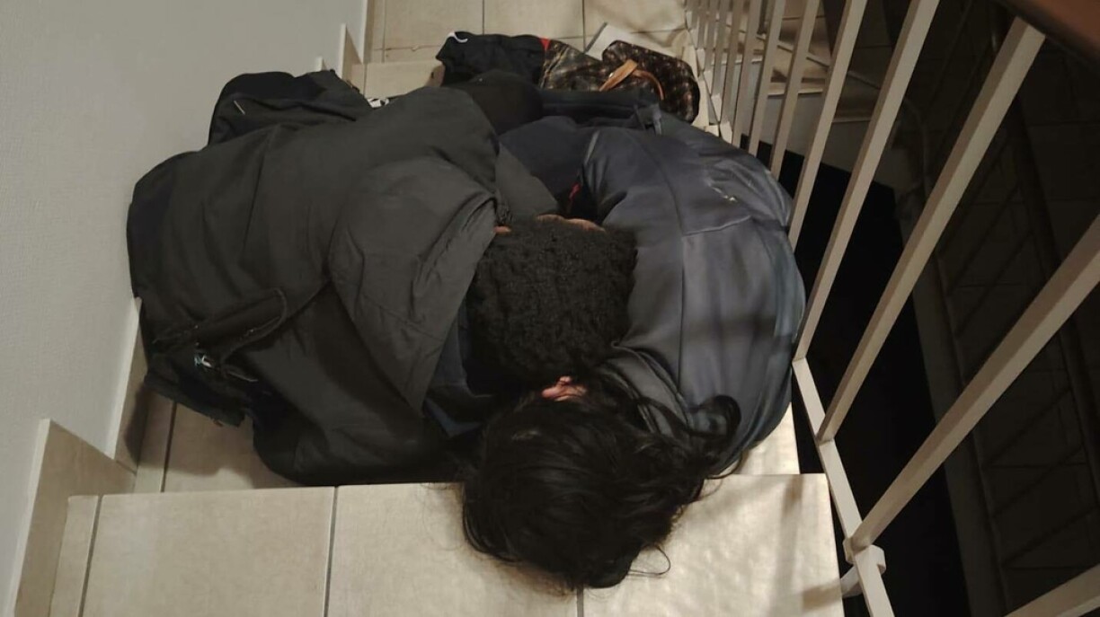 Two people slept on the stairs in Emeline and Jérôme's building.