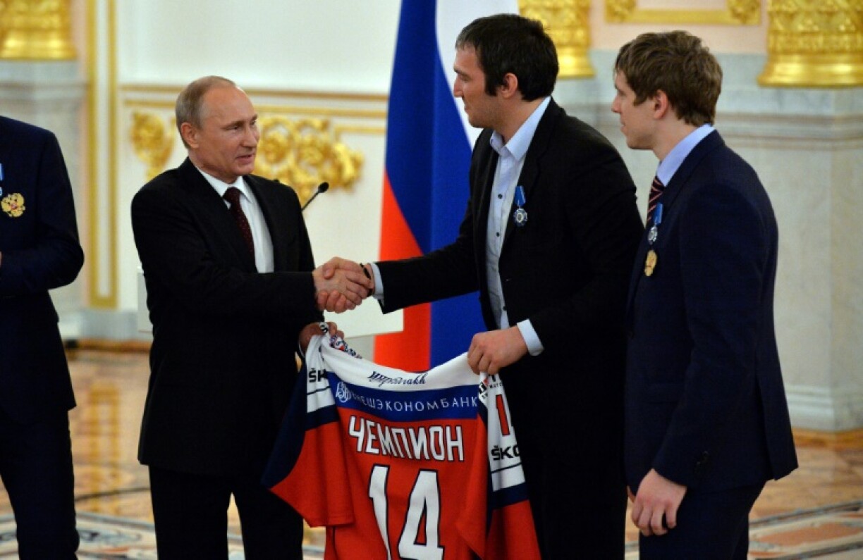 Alex Ovechkin (center) has faced criticism for his ties to Russian leader Vladimir Putin
