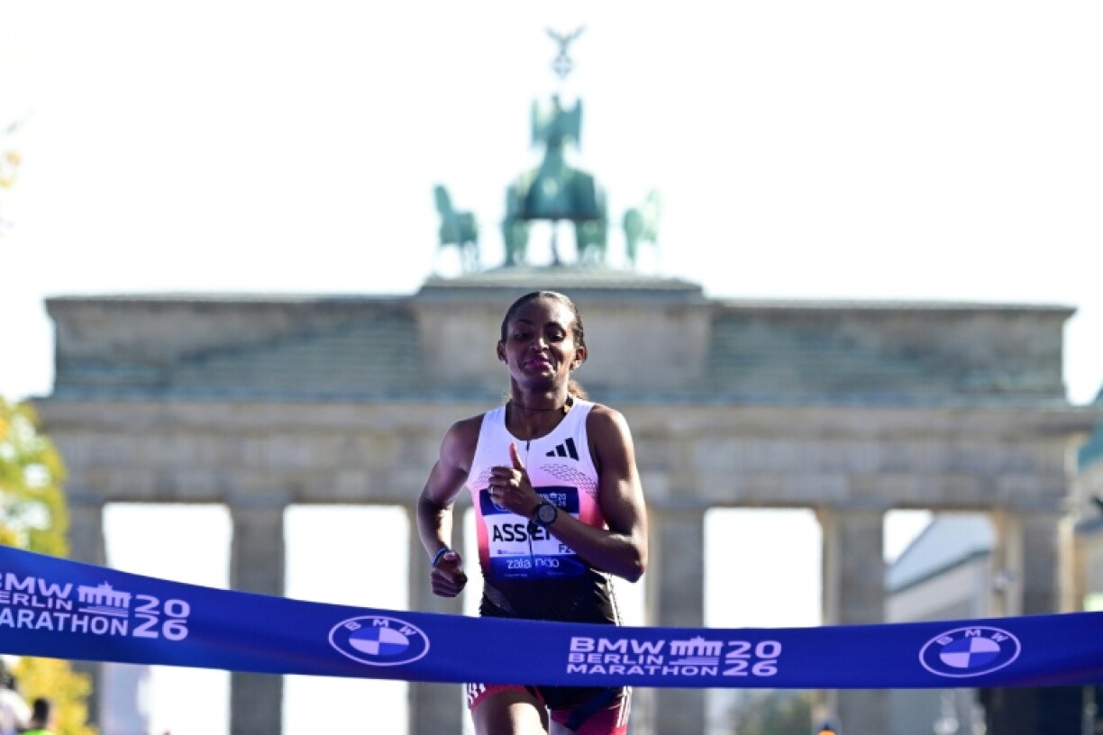 Ethiopia's Tigst Assefa crosses the finish line to win the Berlin Marathon