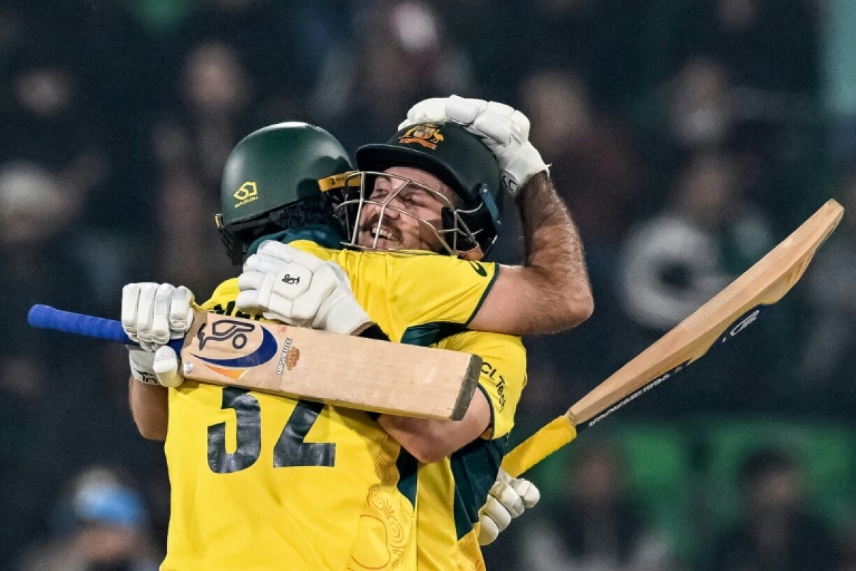 Chase masters: Australia's Josh Inglis (R) celebrates with teammate Glenn Maxwell after reaching his century