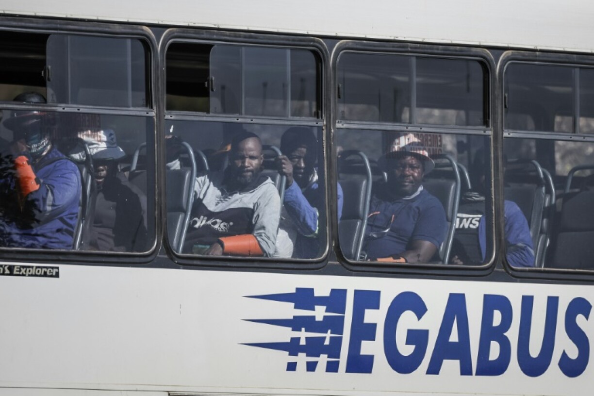 Rescued miners left the site on a bus