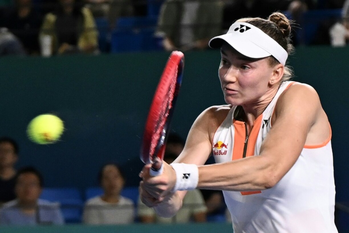 Kazakhstan's Elena Rybakina hits a return to Italy's Jasmine Paolini