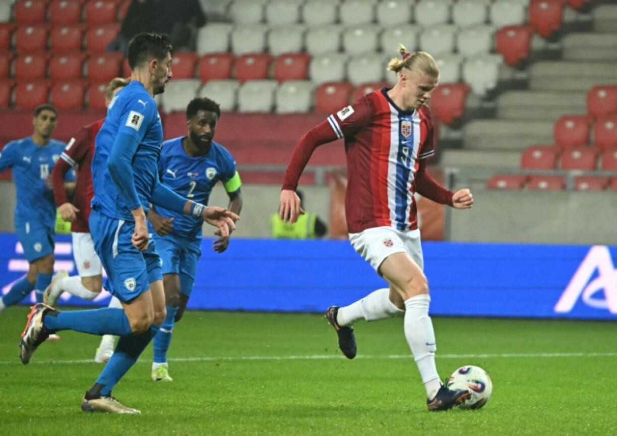 Erling Haland tucks home Norway's fourth against Israel