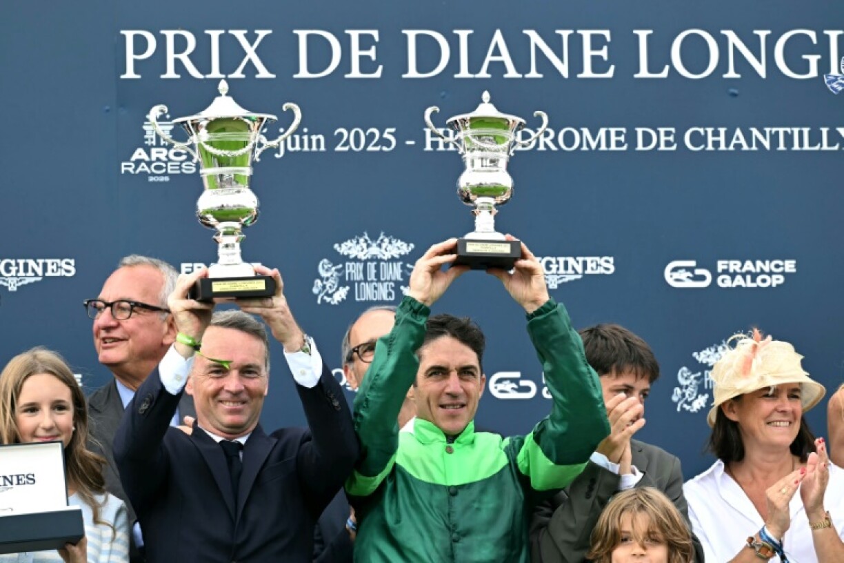 Francis Graffard (L) is delighted he chose to be a trainer and not the Formula One driver his father wanted