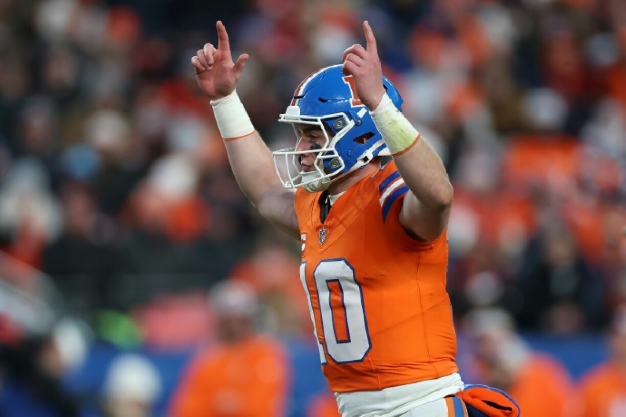 Denver Broncos quarterback Bo Nix celebrates as his team booked their place in the NFL playoffs.