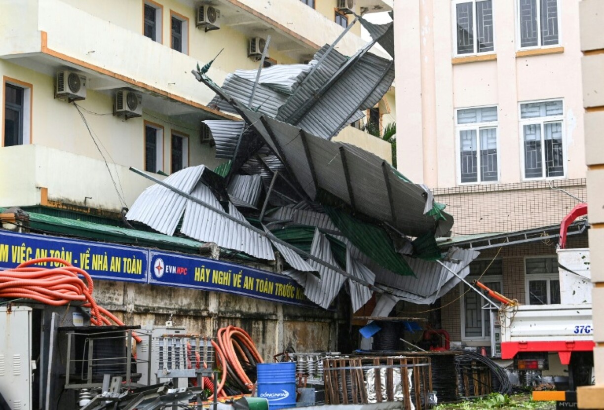 Images published by AFP showed corrugated metal roofs blown off buildings and household debris strewn across saturated streets in coastal Nghe An province