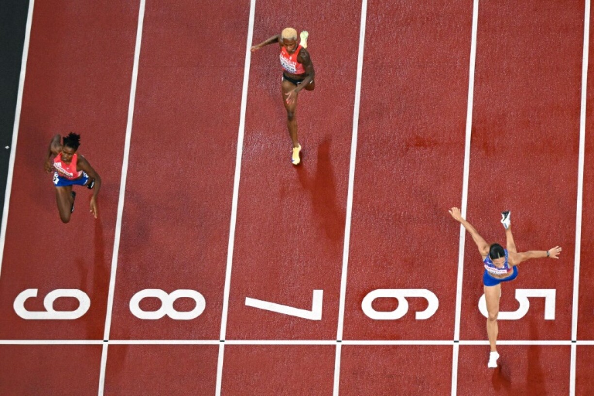 Sydney McLaughlin-Levrone (R) ran the second fastest time in history to win world championships gold in the women's 400m