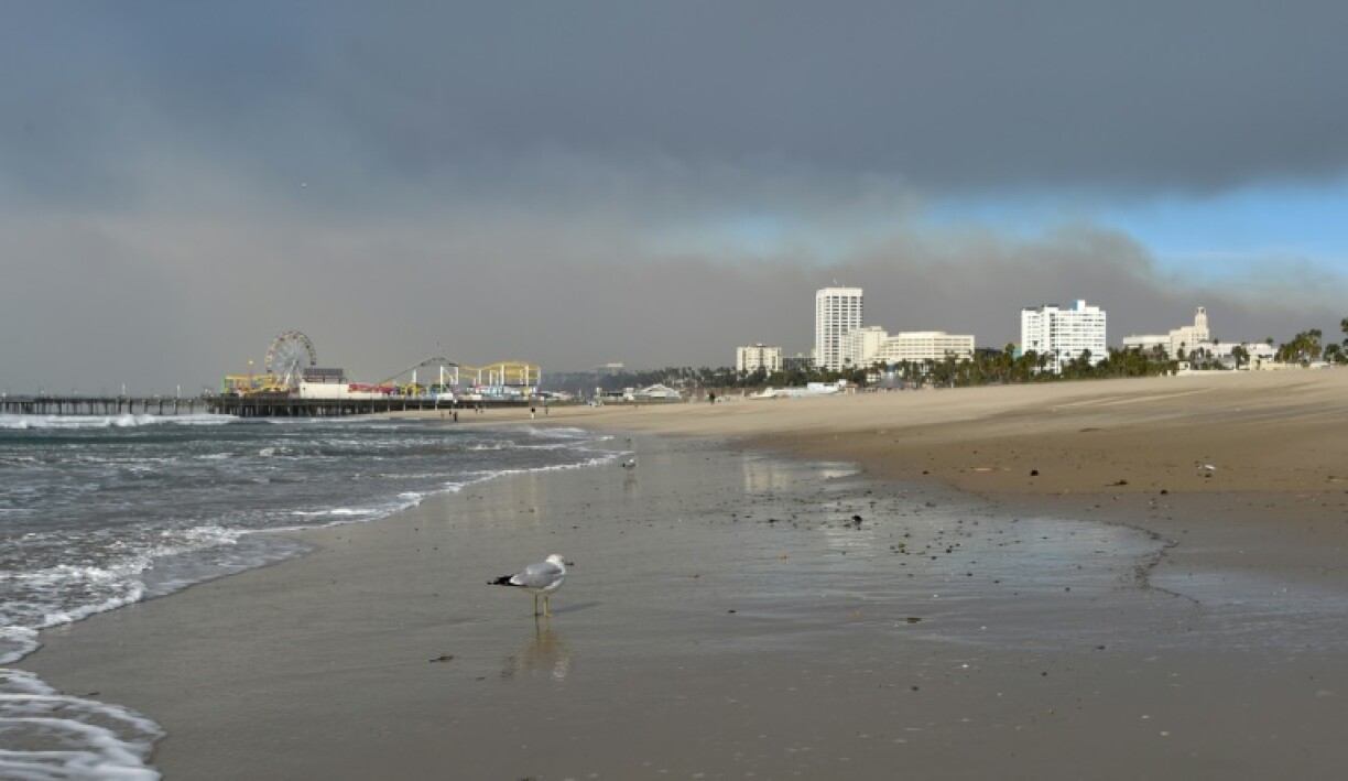 Devastating wildfires near Los Angeles have postponed an NHL contest and have the NFL monitoring developments ahead of a nearby Monday playoff game