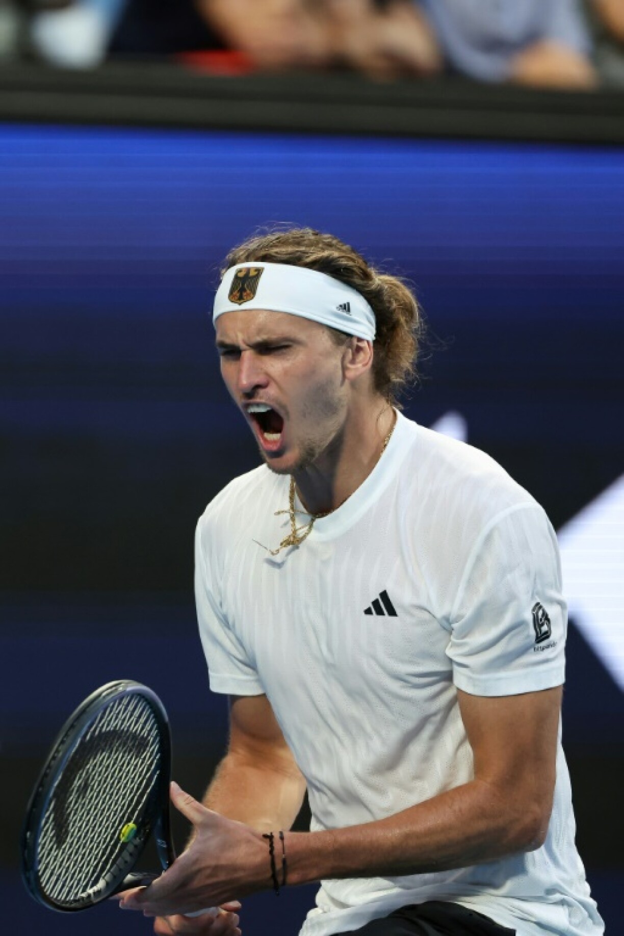 Alexander Zverev shook off a sloppy start to beat China's Zhang Zhizhen