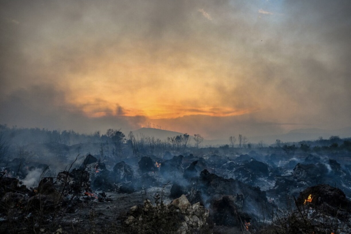 Smoke rising from a wildfire-scorched forest near Zogaj in Montenegro