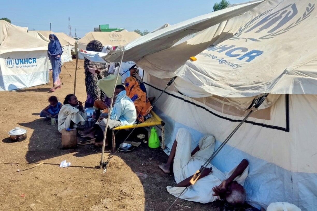Sudanese who fled violence in Al-Jazira state rest at a camp for the displaced in the eastern city of Gedaref