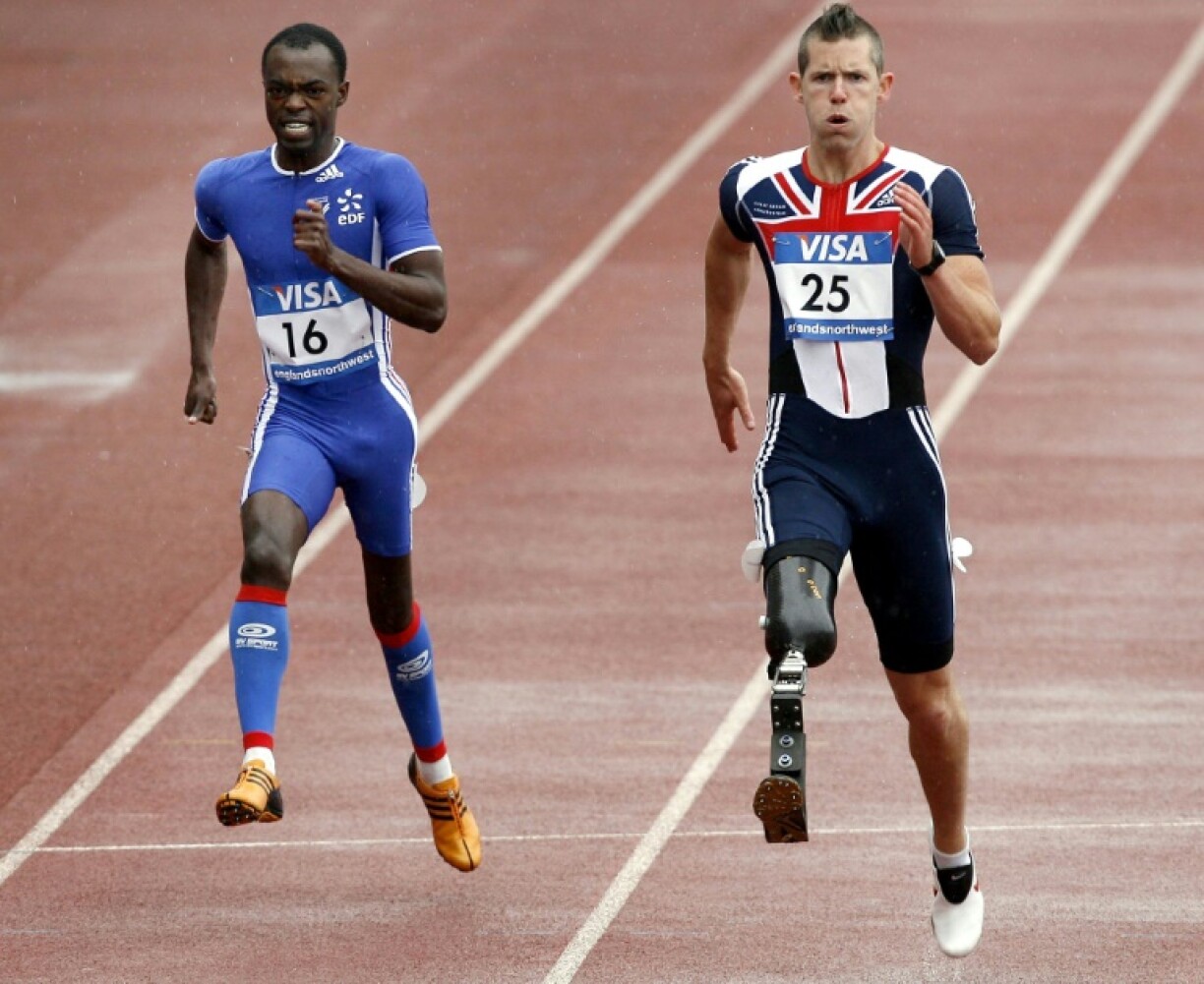 John McFall, right, running in the 2007 Paralympics. He has now been cleared to fly to the ISS