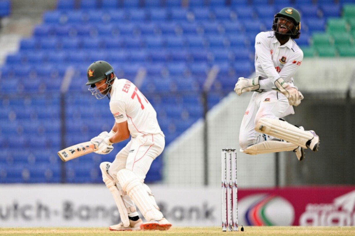 Bangladesh’s wicketkeeper Jaker Ali (R) celebrates after the dismissal of the Zimbabwe’s captain Craig Ervine