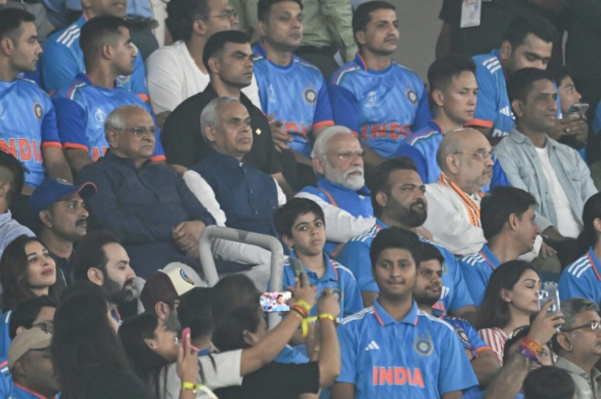 Indian Prime Minister Narendra Modi (C) and Home Minister Amit Shah (C,R) during the 2023 men's ODI World Cup in Ahmedabad -- at the Narendra Modi Stadium