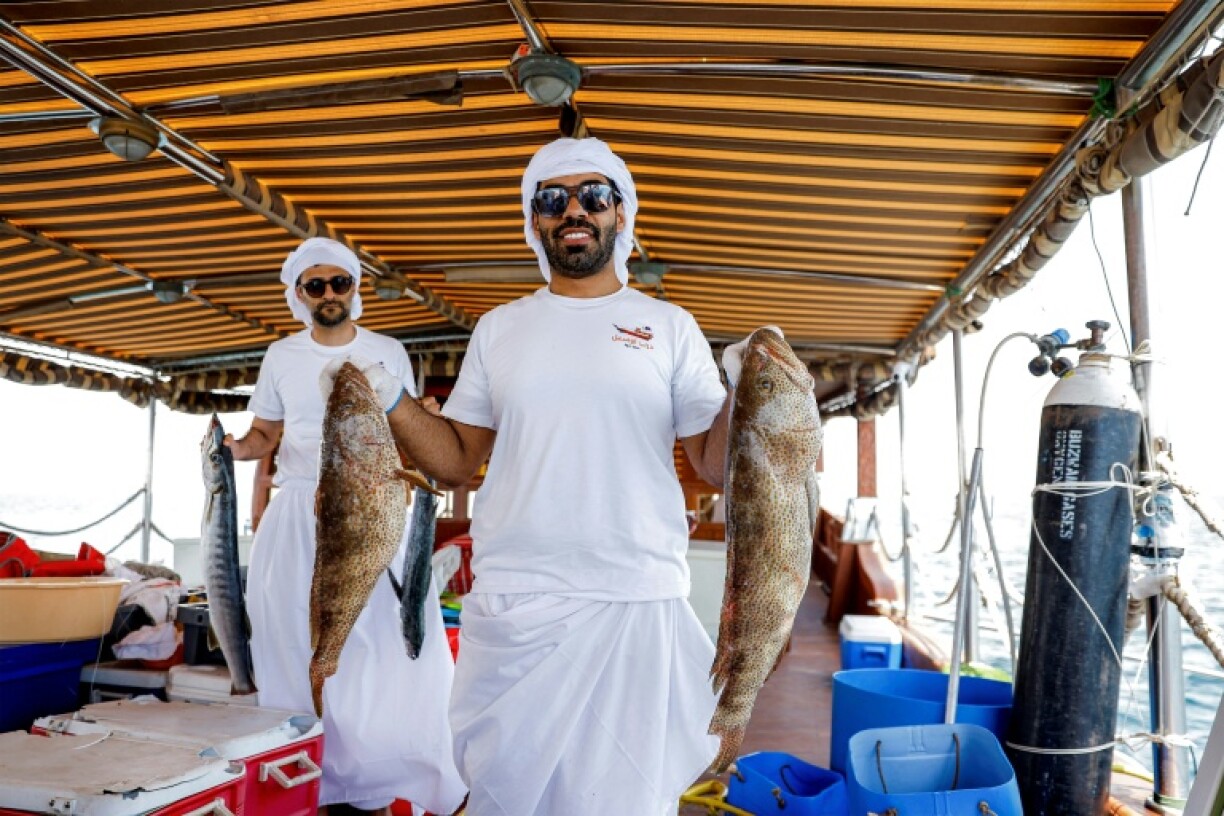A Qatari contestant shows off his catch in a line-fishing competition that forms part of a festival aimed at reviving the emirate's sea-faring tradition.