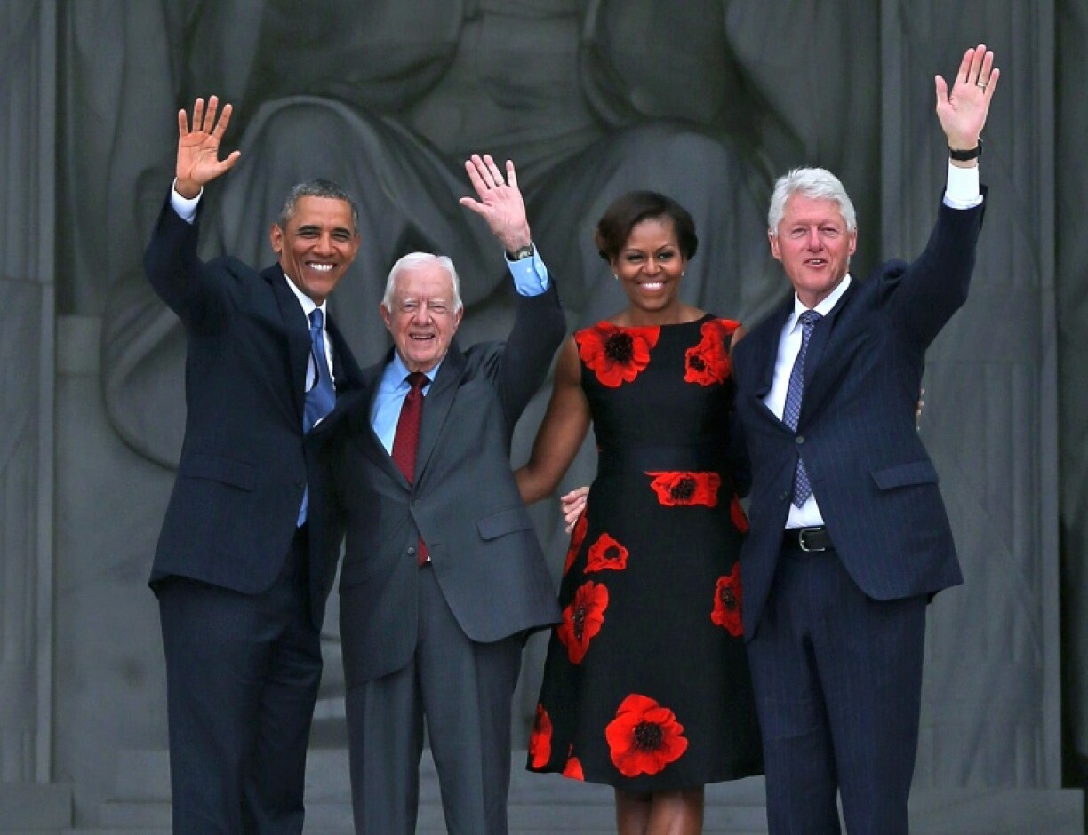 Former presidents including Barack Obama and Bill Clinton, pictured here with Jimmy Carter in 2013, paid tribute to the one-time peanut farmer and Nobel laureate