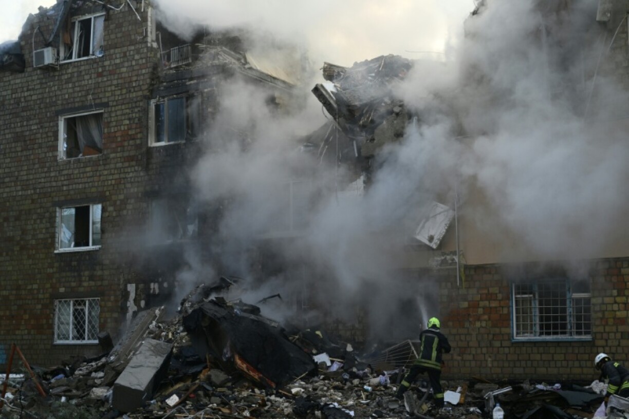 The attack blasted a five-storey crater in one apartment block, ripping the building in two