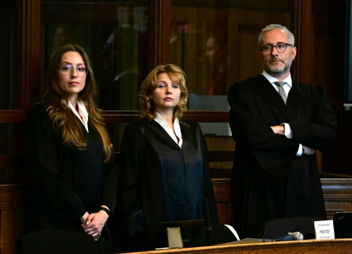 The defendant's court-appointed lawyers, Klaudia Dawidowic, Ria Halbritter and Christoph Stoll, wait for the start of the trial of a palliative care doctor accused of killing 15 patients with lethal injections