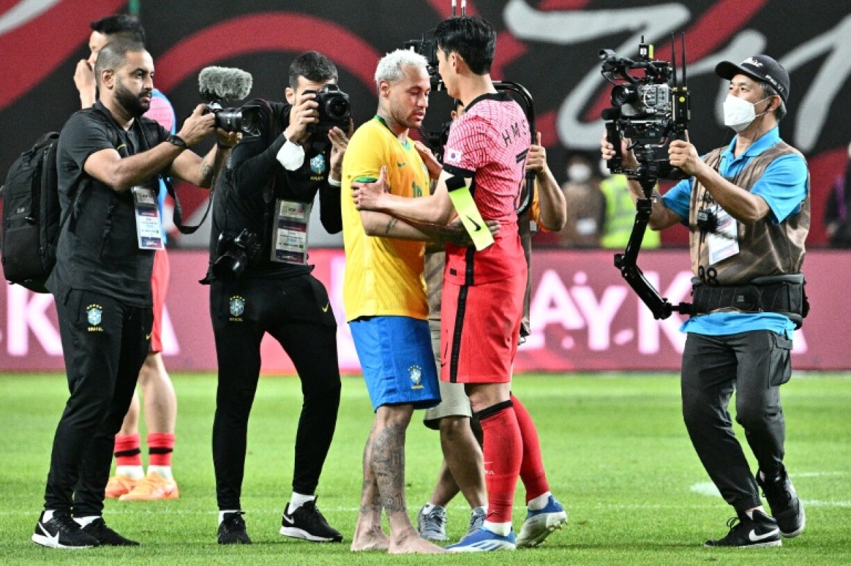 Brazil's Neymar and South Korea's Son Heung-min hug at full-time on the last occasion the two teams met in Seoul in 2022