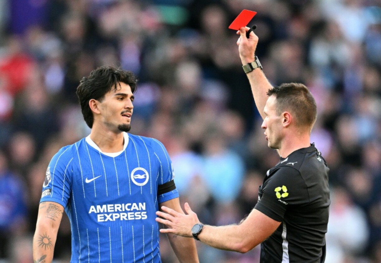 Referee Thomas Bramall shows a red card to Brighton defender Pascal Struijk during the Seagulls' 2-0 Premier League win away to Sunderland