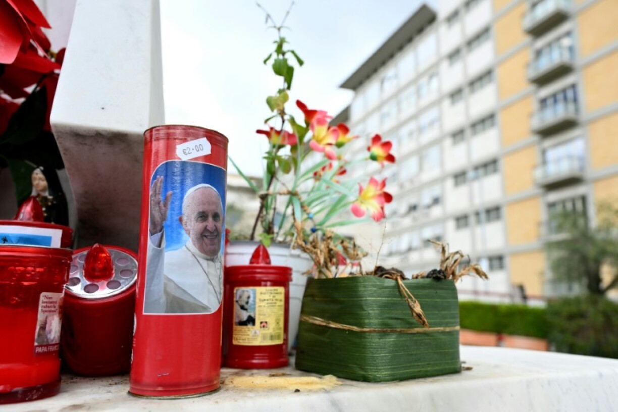 A candle with a picture of Francis outside the Gemelli hospital