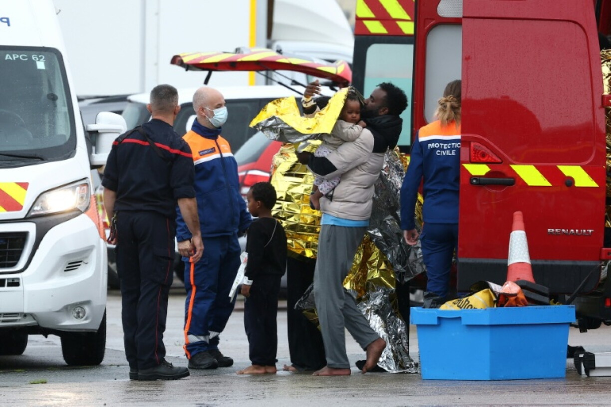 Survivors disembarked a rescue boat at the port of Calais, some on stretchers and in wheelchairs, many wrapped in emergency blankets