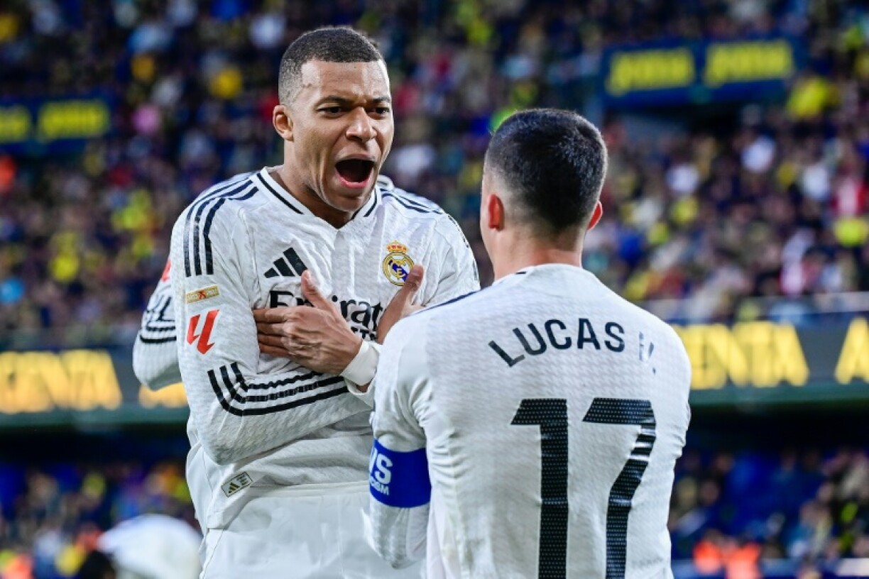 Real Madrid's French forward Kylian Mbappe celebrates his second goal at Villarreal on Saturday as his team moved top