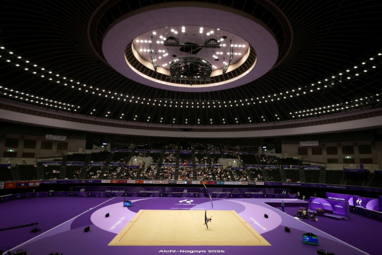 Uzbekistan’s Lola Djuraeva competes in the individual ribbon of the rhythmic gymnastics qualification round during the 2026 Asian Games at the Nagoya General Gymnasium in Nagoya on October 1, 2026.
