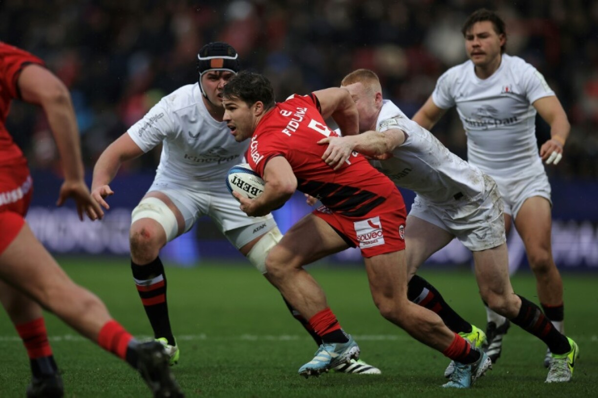 Antoine Dupont (C) scored one of Toulouse's nine tries against Ulster in the Champions Cup at Ernest-Wallon stadium