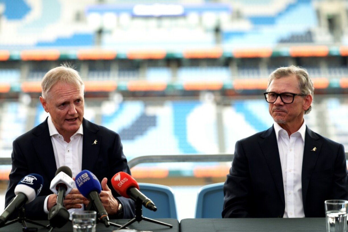 Wallabies coach Joe Schmidt (left) abd his successor Les Kiss talk to media in Sydney