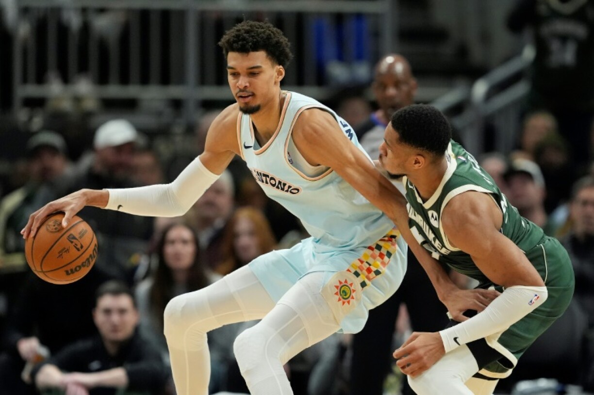 International stars Giannis Antetokounmpo of Greece and the Milwaukee Bucks, right, and San Antonio's French standout Victor Wembanyama, left, will be teammates at the NBA All-Star tournament on February 16