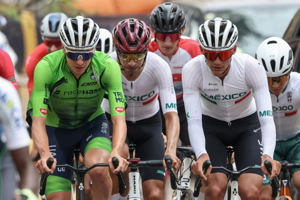 Tadej Pogacar (left) training for Sunday's road race