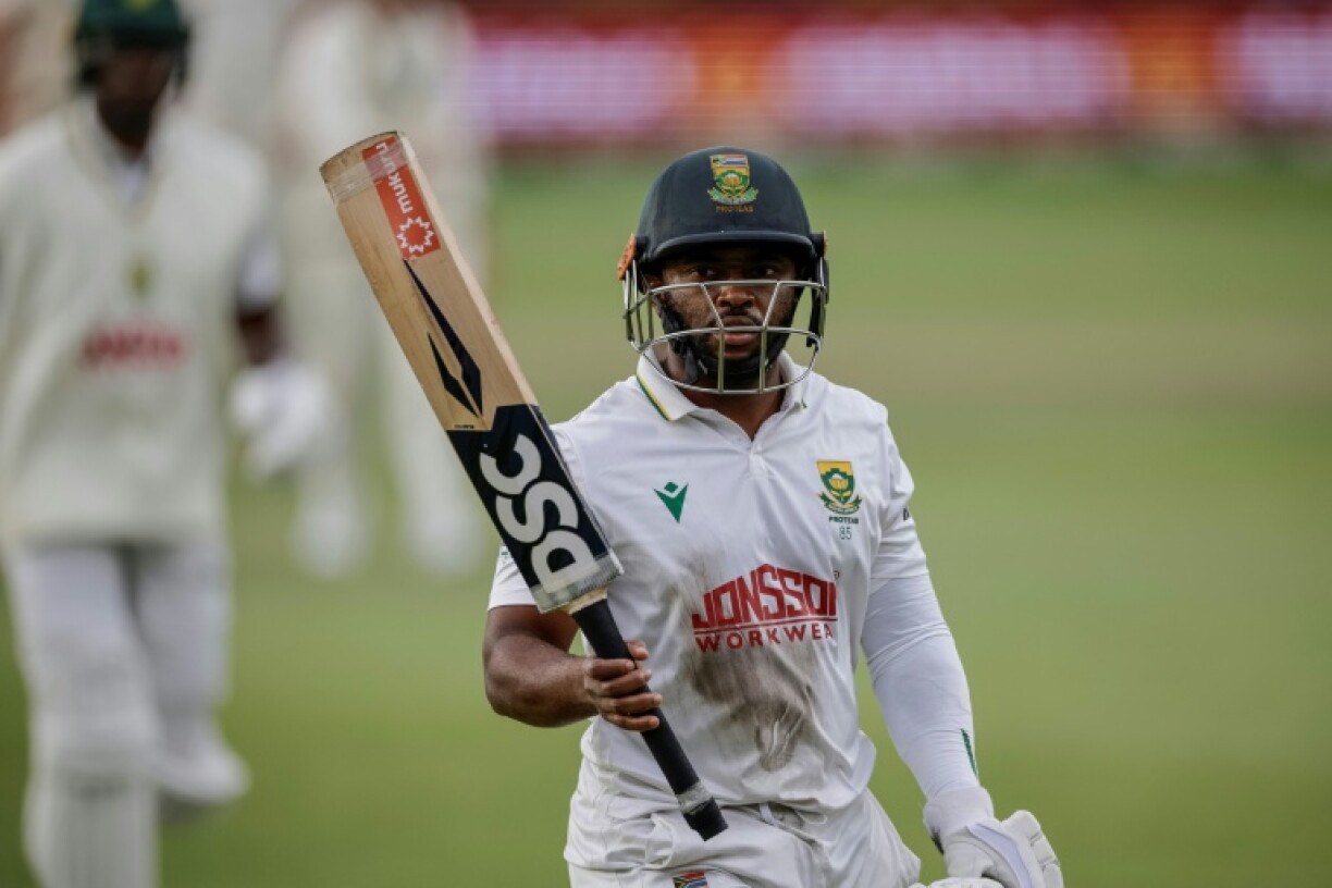 South Africa's Temba Bavuma walks back to the pavilion after smacking a career-best 179 runs