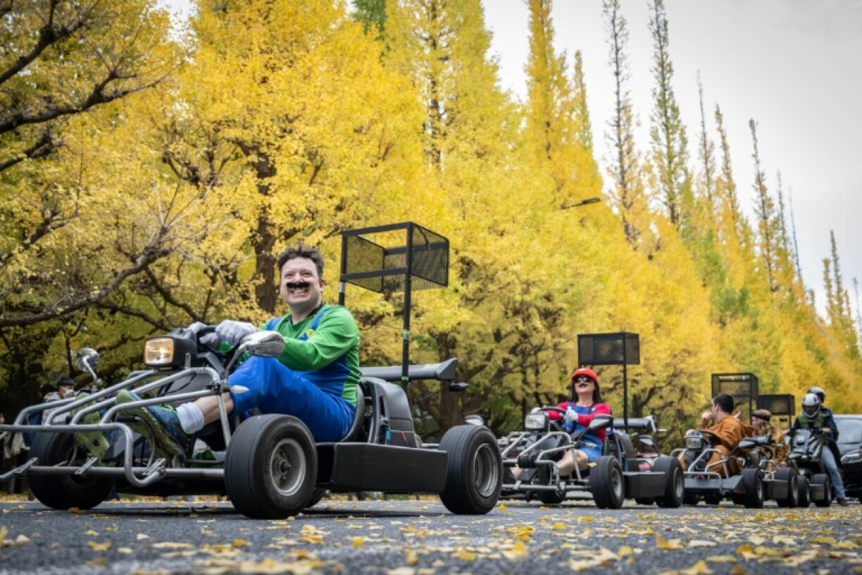 People drive go-karts while dressed in Super Mario costumes in Tokyo in 2022