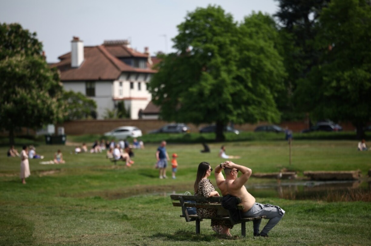 People bask in the record heat at London's Wimbledon Common